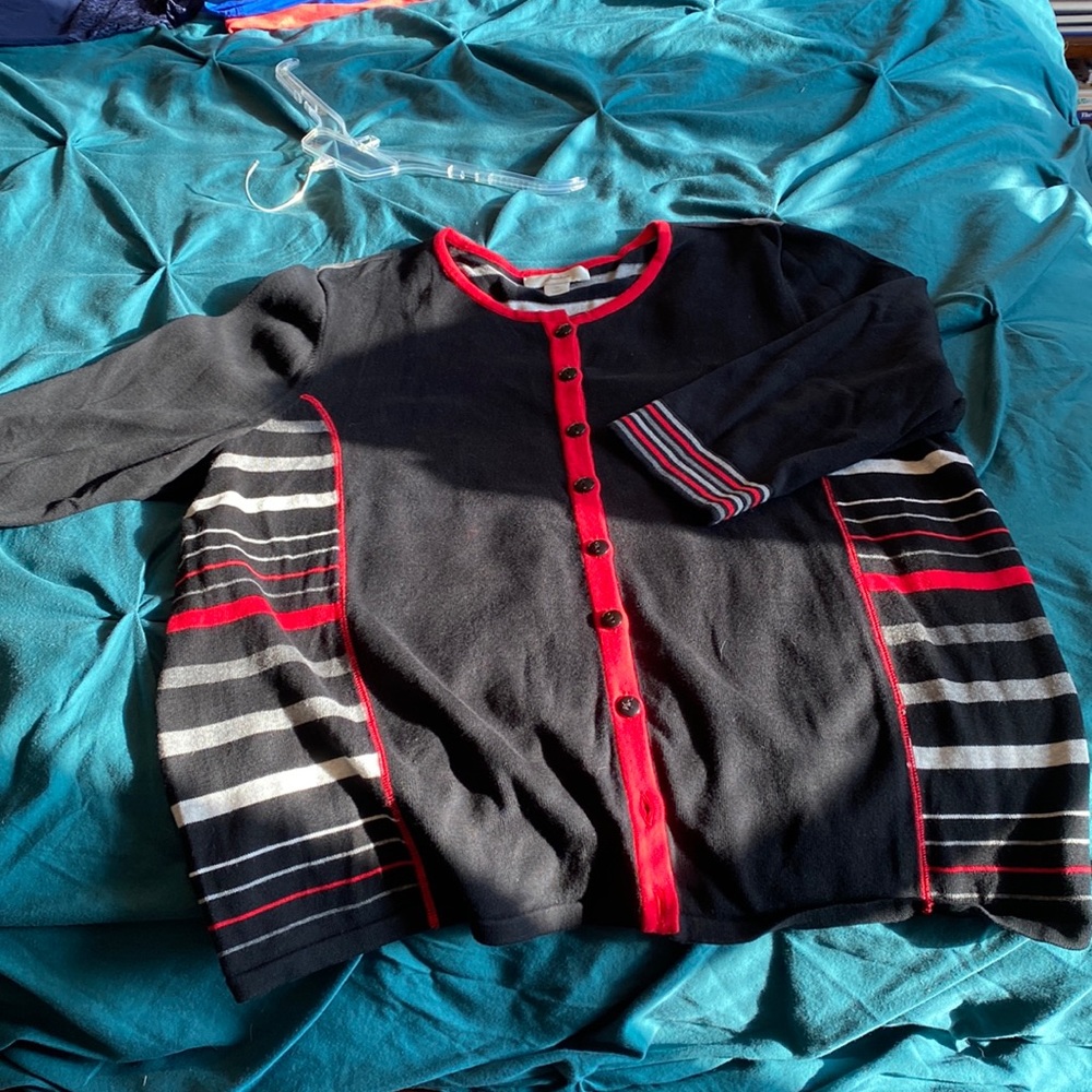 Black with red, white and gray stripes button front cardigan.